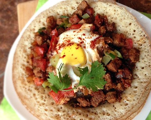 Flatbread with sautéed meat and egg